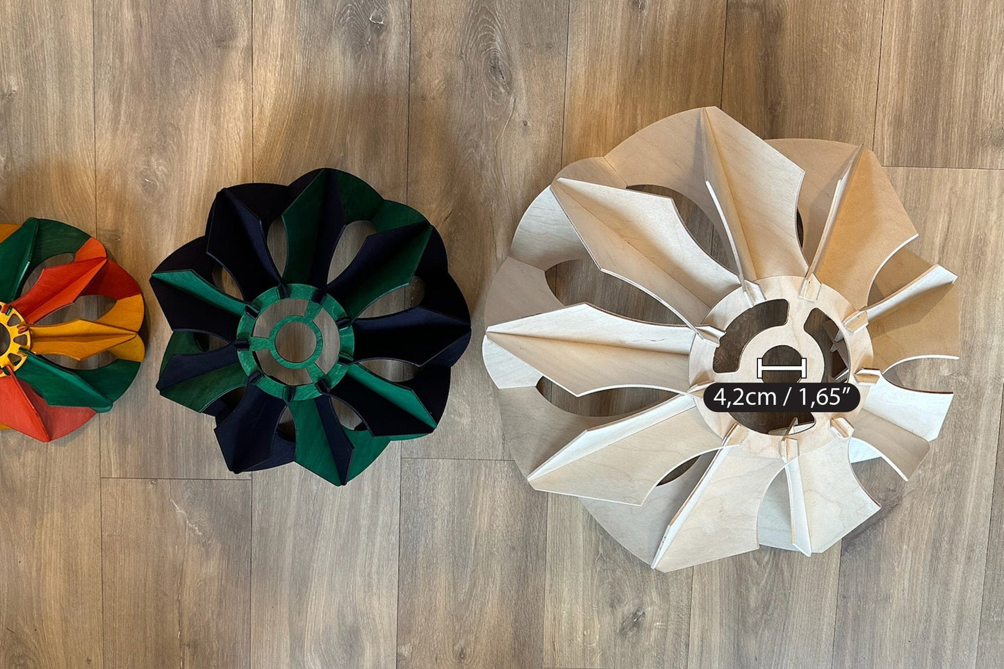Top-down view of the three pendant lamps, displaying the flower-like design and the central opening, with the large one having a 4.2cm (1.65") diameter hole for fixture installation.