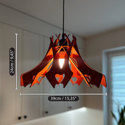 Scarlet-colored wooden pendant lampshade with a 24 cm (9,45") height and 39 cm (15,35") diameter. The lamp hangs in a modern kitchen, providing a vibrant accent to the clean, minimalist decor.