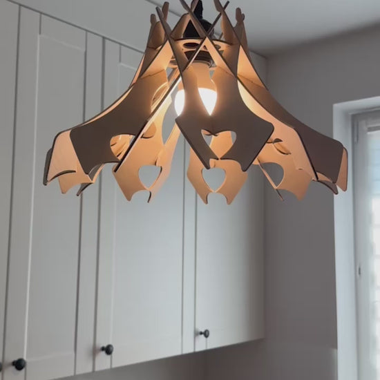 A short video displaying various angles of the handcrafted wooden pendant lamp in a "Hearts" design, emphasizing its detailed craftsmanship, sustainable materials, and the soft, heart-shaped cut-outs.