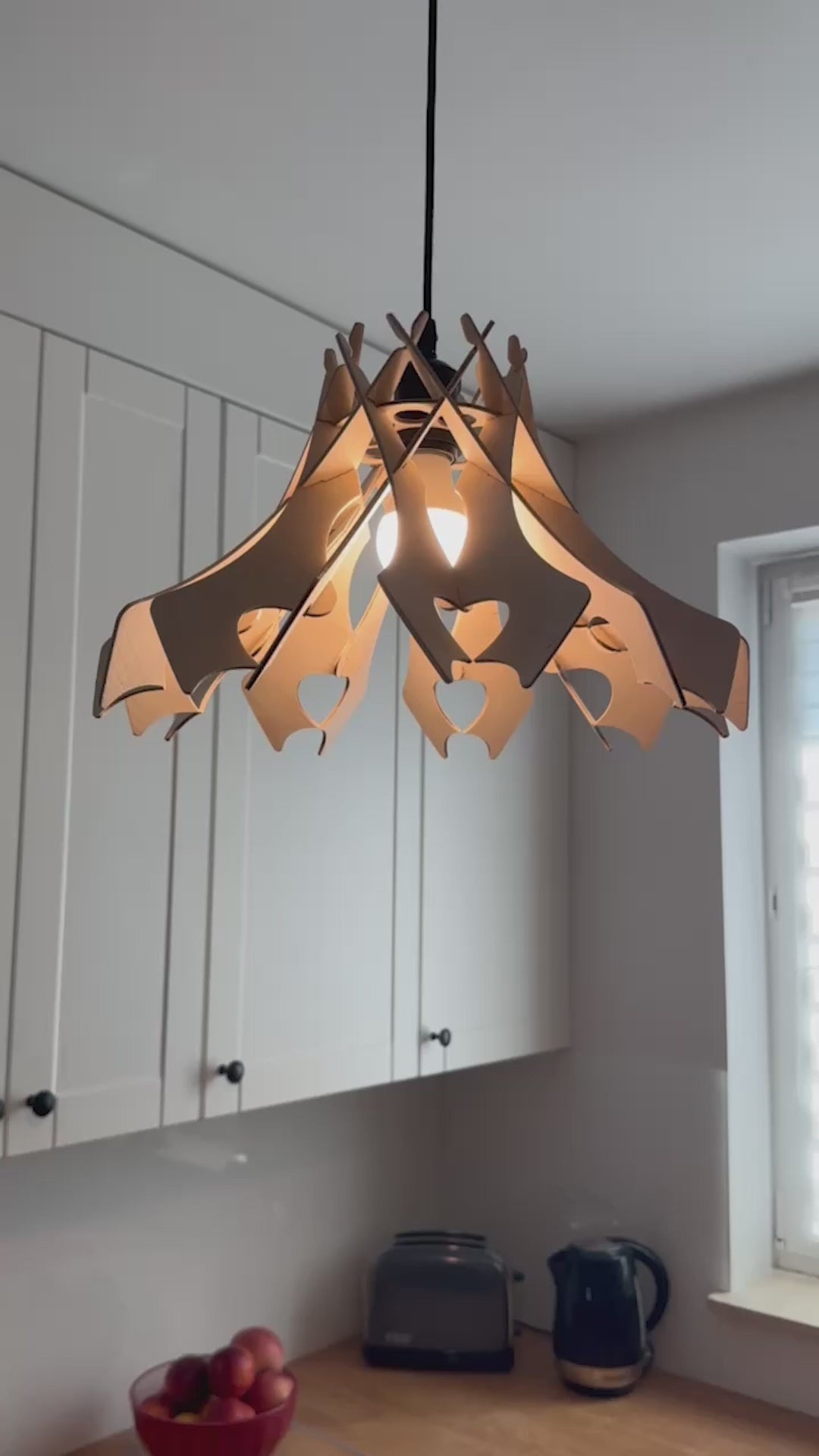 A short video displaying various angles of the handcrafted wooden pendant lamp in a "Hearts" design, emphasizing its detailed craftsmanship, sustainable materials, and the soft, heart-shaped cut-outs.