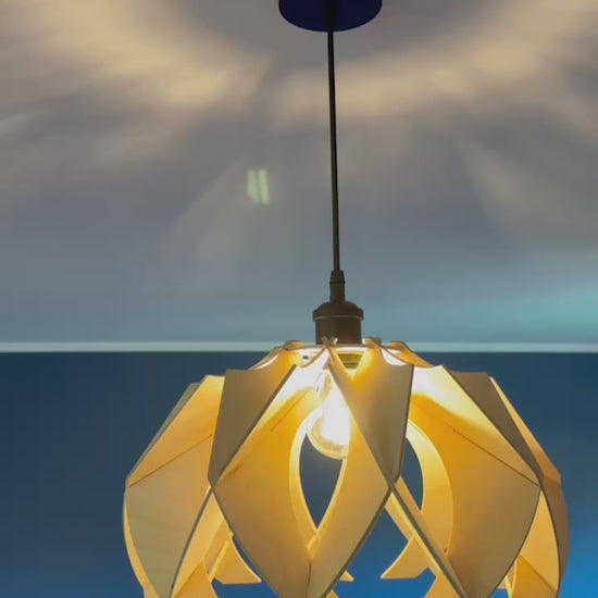 Short video showcasing different views of handcrafted medium wooden pendant lamps with a modern flower-like design, highlighting the intricate craftsmanship, eco-friendly materials, and the beautiful light patterns they create.